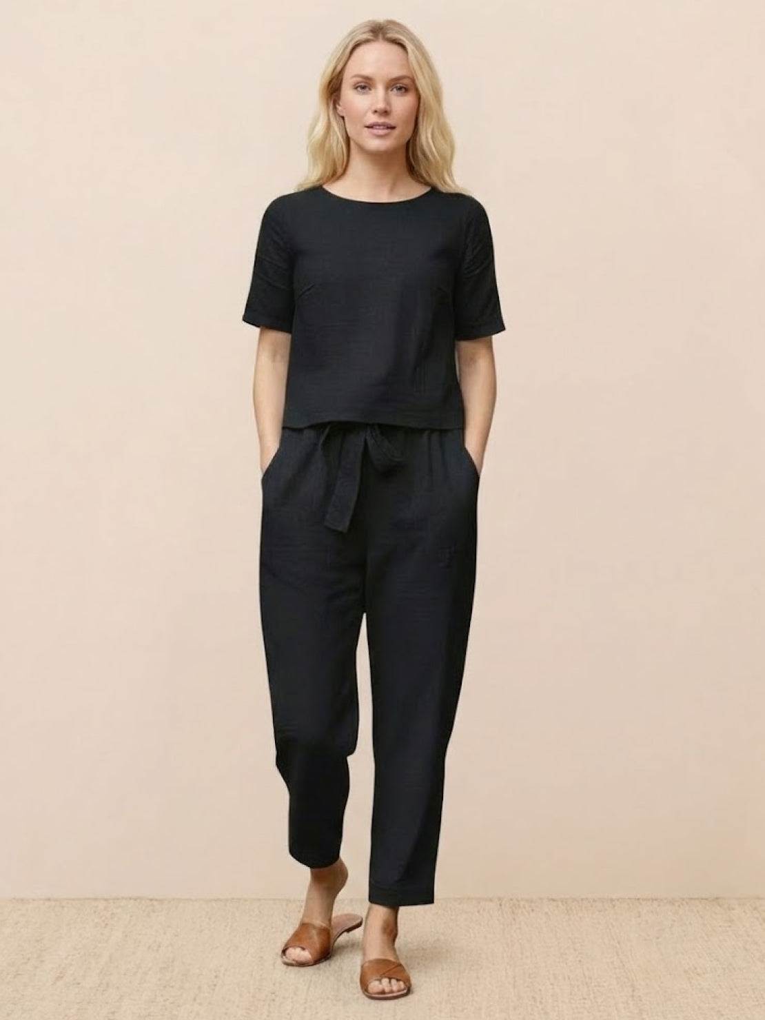 Woman wearing 100% cotton linen monochrome set with short-sleeve top and straight-leg pants in breathable fabric