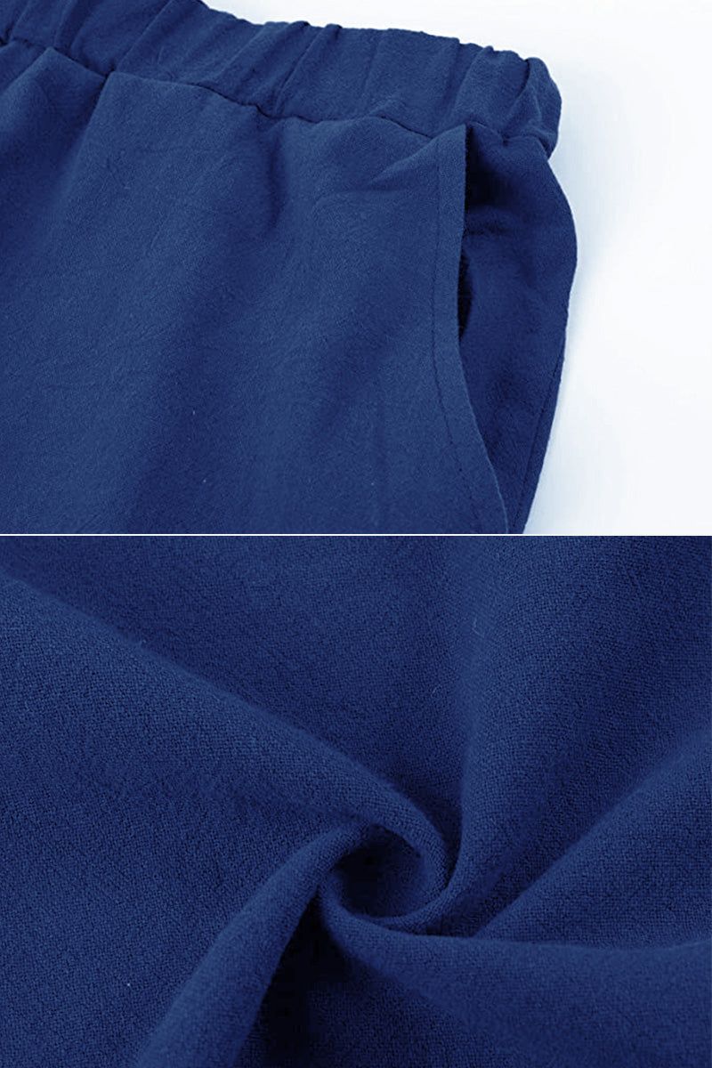 close-up of navy blue 100% cotton linen fabric with elastic waistband and pocket detail