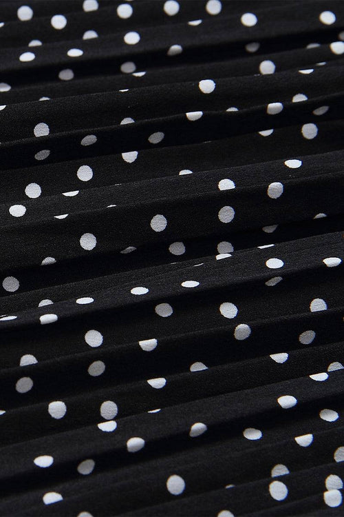 Close-up of black pleated fabric with white polka dots from Effortlessly Chic Polka Dot Pleated Skirt Set