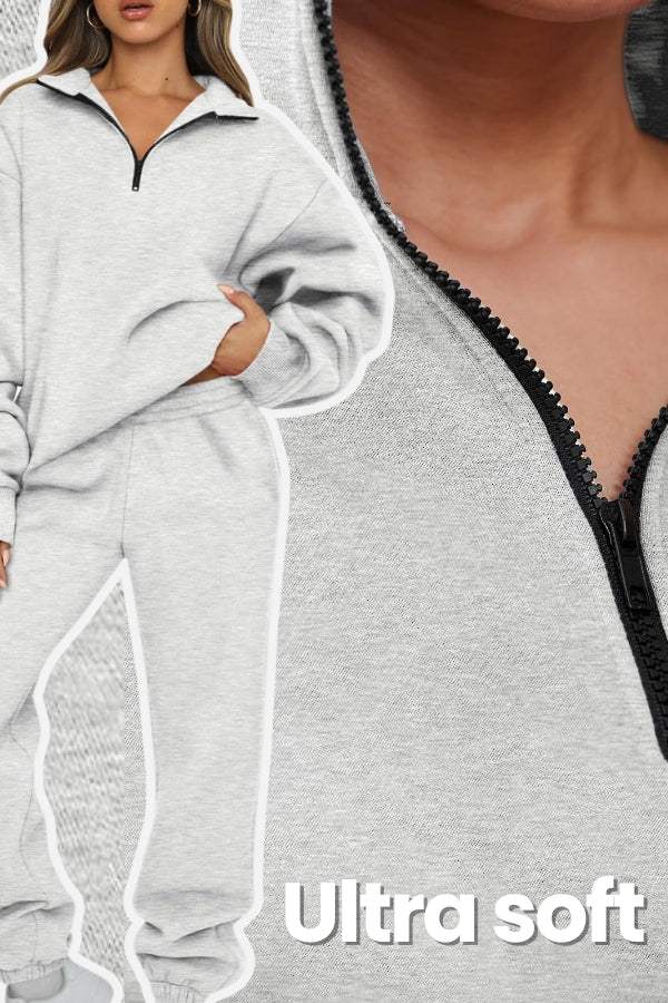 Woman wearing light grey ultra-soft and comfy co-ord tracksuit set with zip-up top and relaxed pants