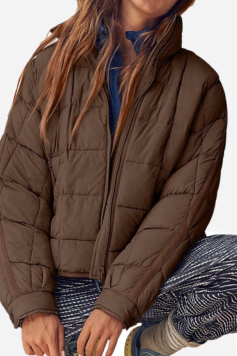 Lightweight puffer travel jacket compressed for packing and versatile style in multiple colors