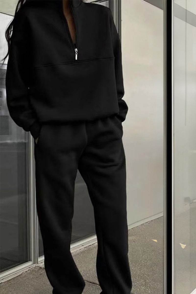 Black cotton-blended two-piece tracksuit with high collar and deep zipper, cozy and stylish athleisure wear