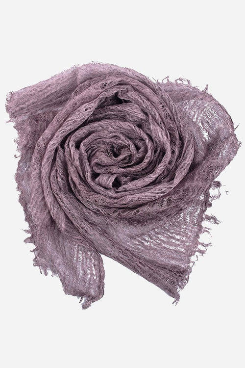 Lightweight linen scarf in lavender with frayed edges, breathable and versatile wrap accessory.