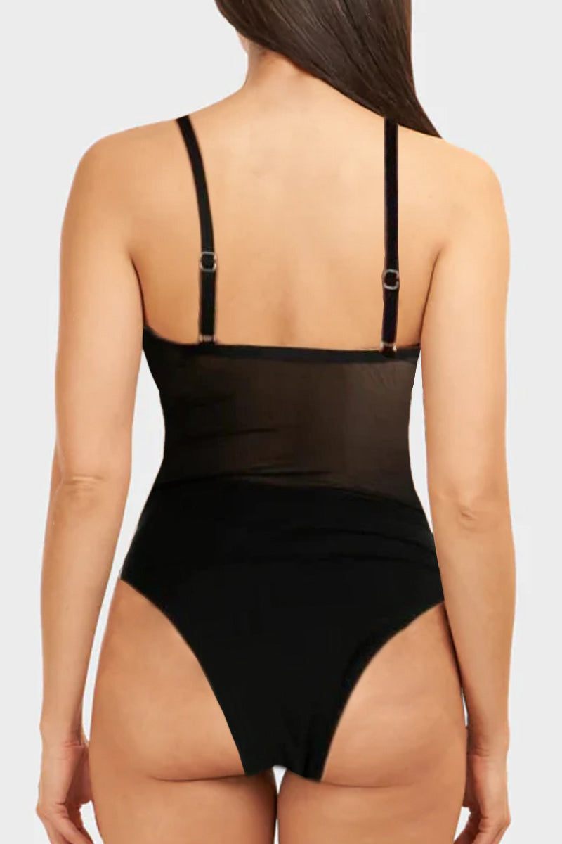 Back view of a black mesh tan-through one piece swimsuit with adjustable straps on a woman