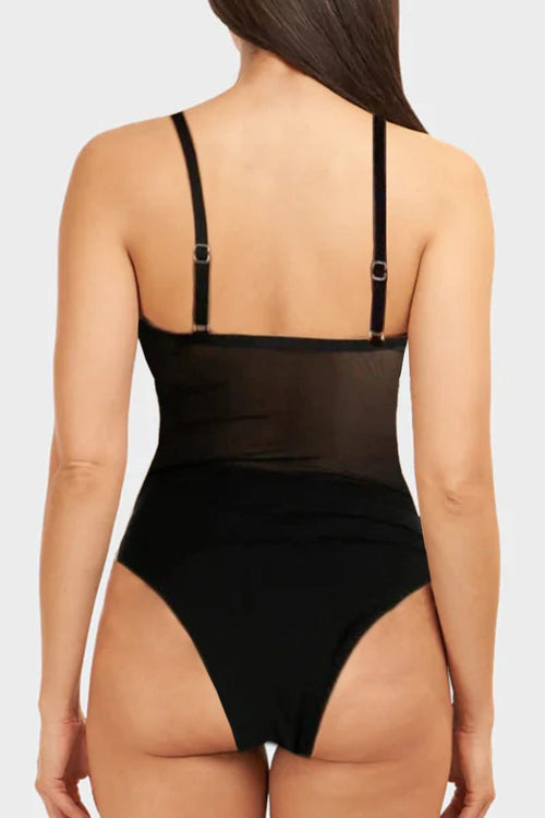 Back view of a black mesh tan-through one piece swimsuit with adjustable straps on a woman