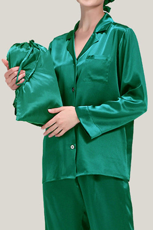 Green classic Mulberry silk pajama set with matching sleep cap held by model