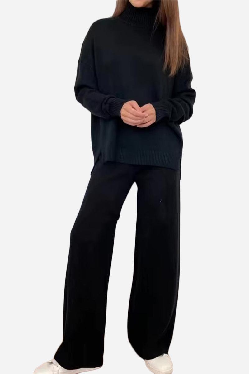 Woman wearing black knitted turtleneck two-piece set with wide-leg pants and white sneakers