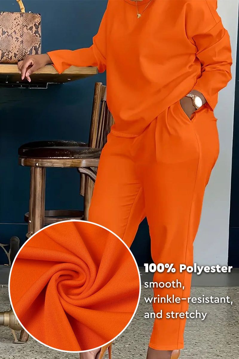 All-Day Comfort 2-Piece Outfit Set in bright orange, smooth wrinkle-resistant polyester fabric, relaxed fit with long-sleeve top and pants.