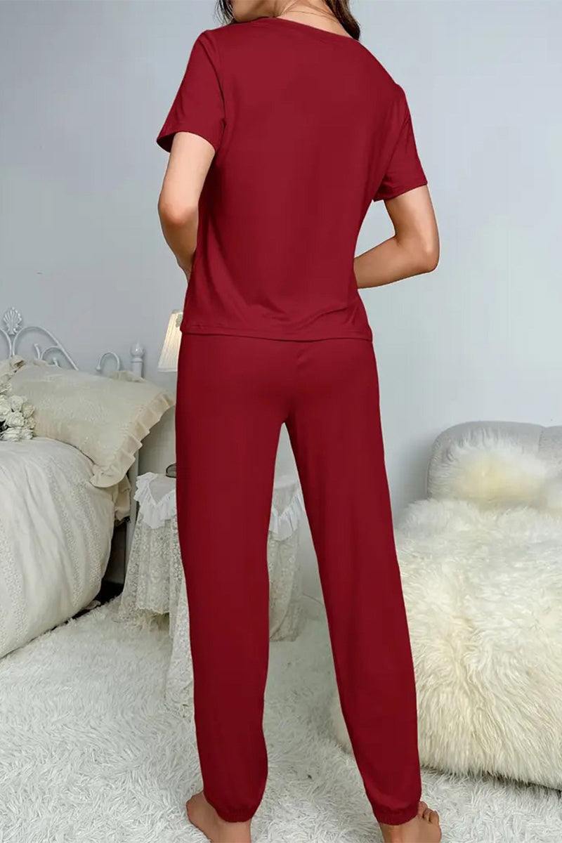 Back view of woman wearing burgundy My Go To Loungewear soft two-piece set in cozy bedroom setting