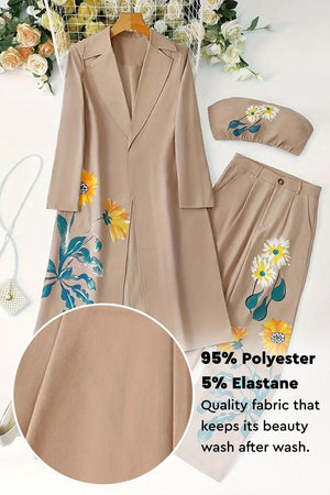 Elegant beige three-piece floral set with long coat, strapless top, and pants featuring vibrant flower prints, made from 95% polyester and 5% elastane.