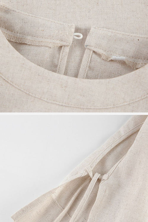 Close-up of breathable cotton-linen fabric texture and button loop detail on beige two-piece set