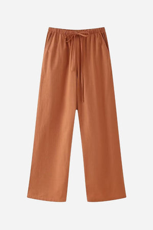 Rusty orange wide-leg pants from versatile Mix-Match Lounge-to-Travel Set, comfortable and stylish for travel and casual wear.