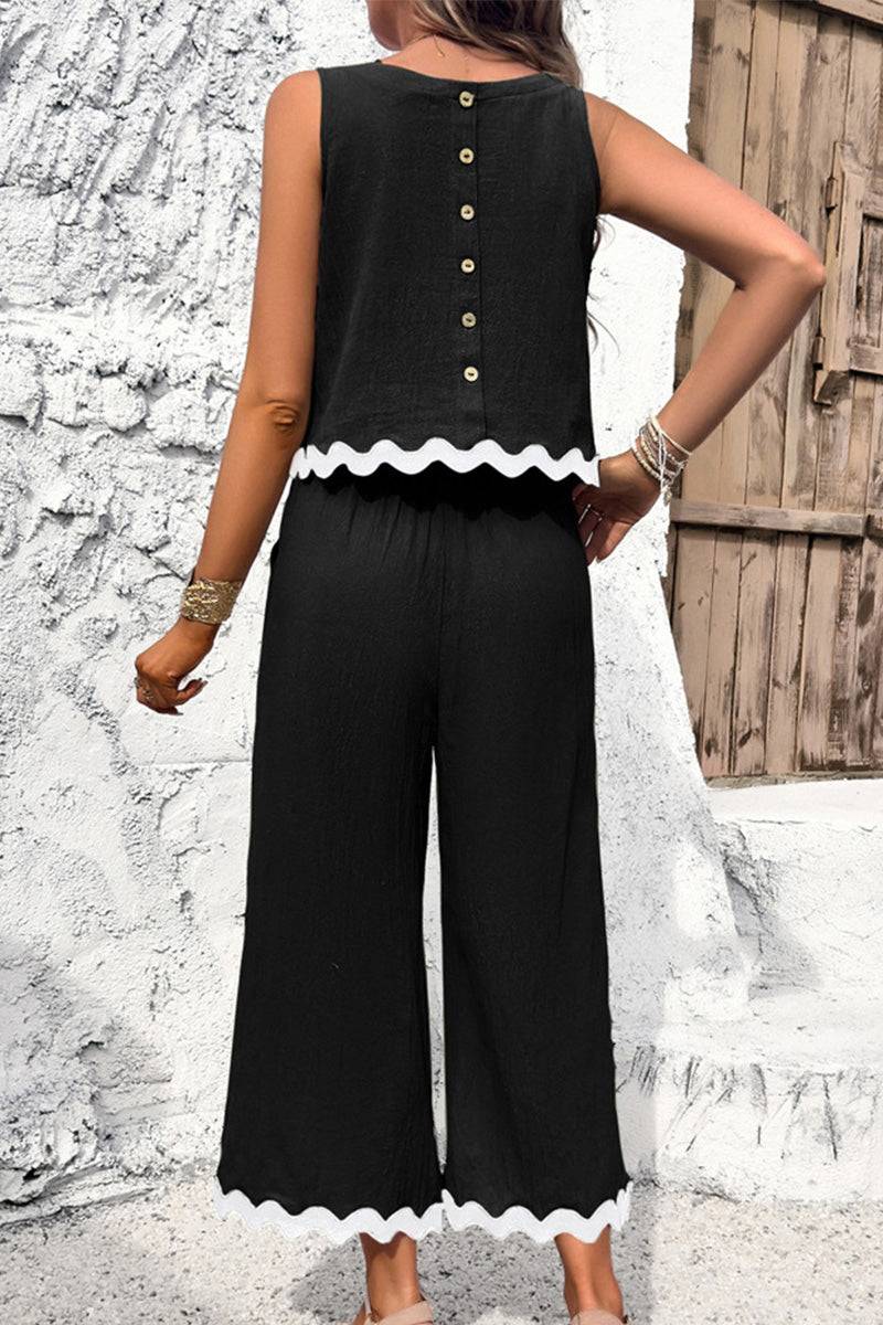 Black scalloped trim sleeveless top and wide leg pants set with button back and white scalloped edges.