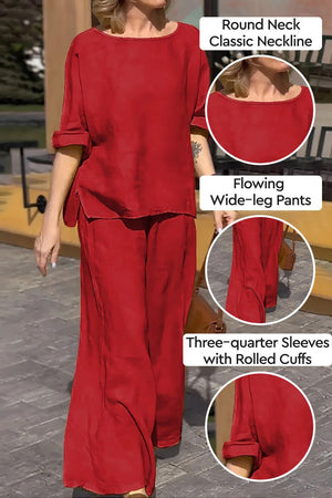 100 cotton two-piece set with round neck top and wide-leg pants in red, featuring three-quarter sleeves with rolled cuffs.