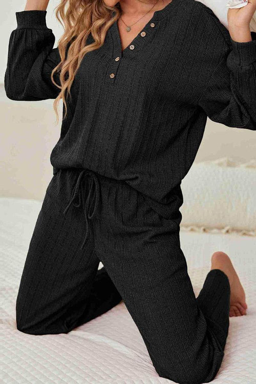 Woman wearing black Desert Bloom Ribbed Comfort Set lounge outfit with ribbed texture and button detail on top