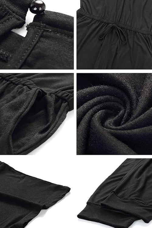 Close-up details of black Moonlit Rome Off-Shoulder Jumpsuit fabric and design features
