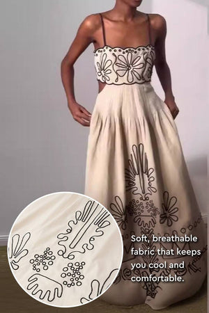Artisan embroidered scallop bohemian dress with floral patterns, soft breathable fabric, and tiered maxi skirt