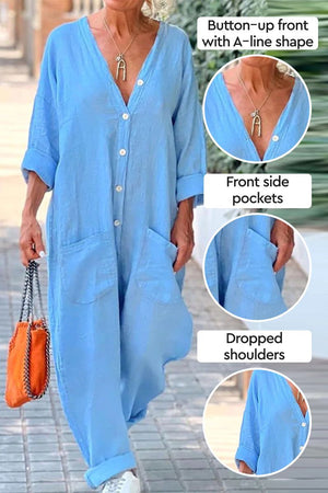 Blue relaxed jumpsuit with button-up front, front pockets, and dropped shoulders.