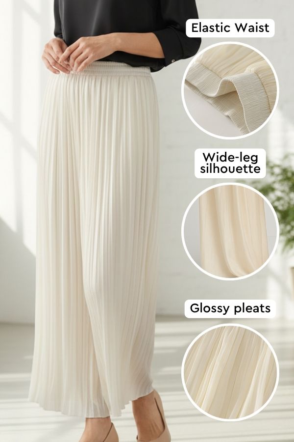 Garden Soirée cotton-silk pleated trousers with elastic waist, wide-leg silhouette, and glossy pleats in light beige.