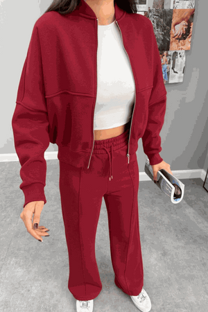 The Voyager Zip Set in red zip-front sweatshirt and wide-leg joggers travel outfit