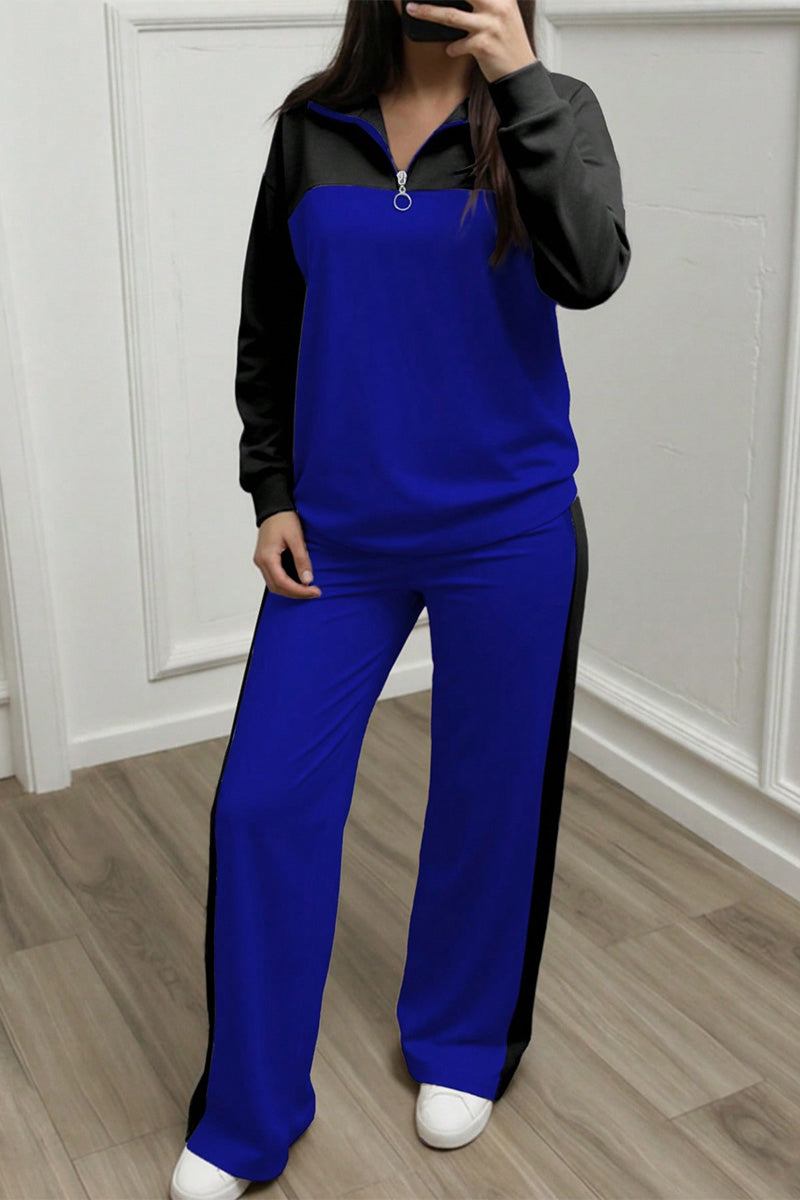 Woman wearing blue and black Colorblock Comfort Leisure Set with half-zip top and wide-leg pants in cozy winter fabric