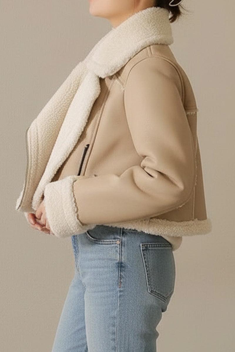 Cropped faux leather sherpa jacket with cream sherpa trim and full lining, styled on model with jeans.
