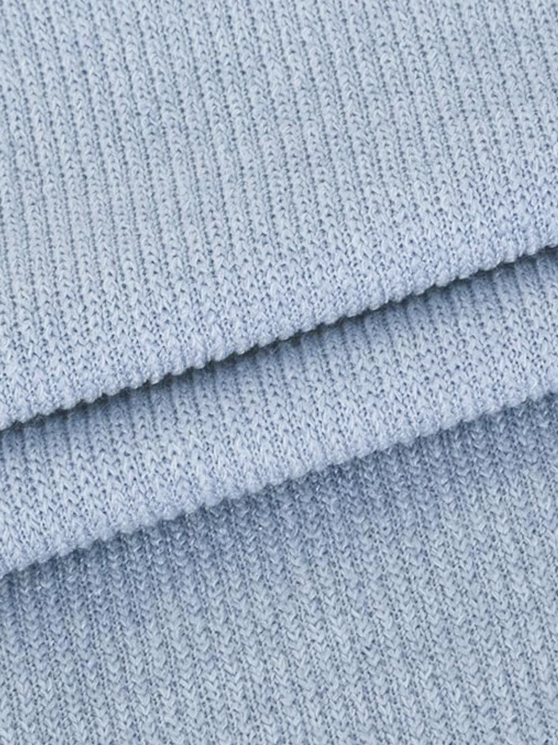 close-up of soft light blue waffle-knit fabric texture for waffle-knit two-piece clothing set