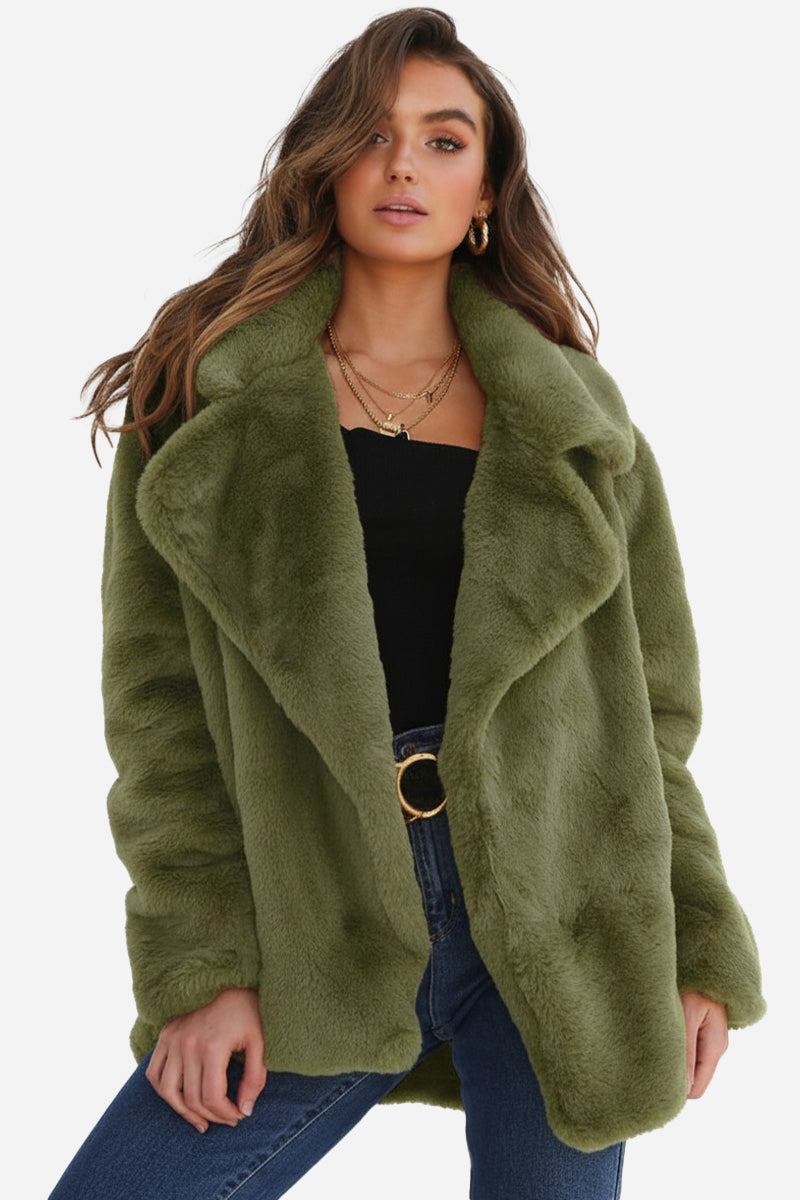 Woman wearing green open front oversized faux fur jacket with draped shawl collar and mid-hip length