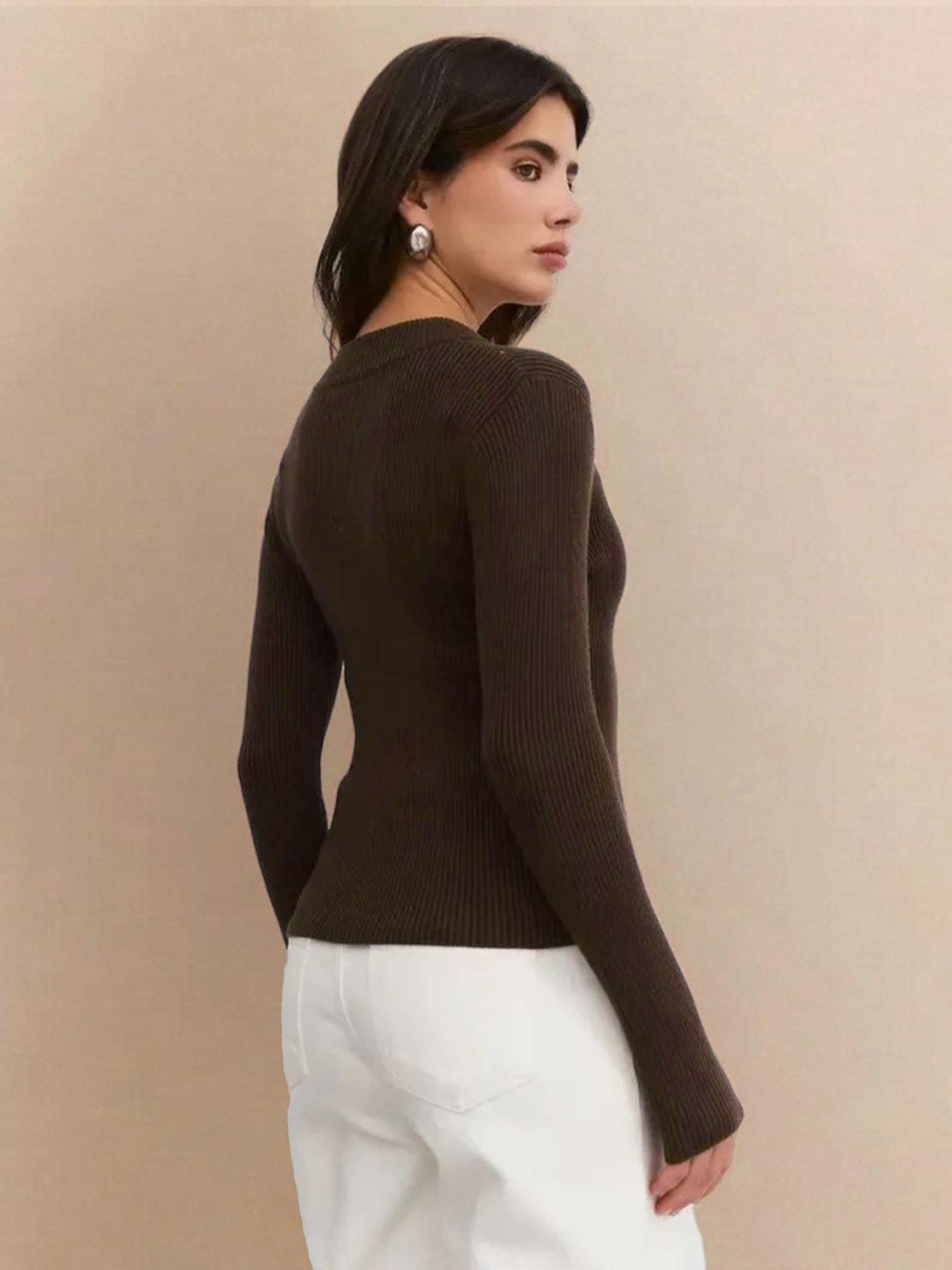 woman wearing slim fit zip-up knit cardigan jacket with vertical ribbing and high neckline