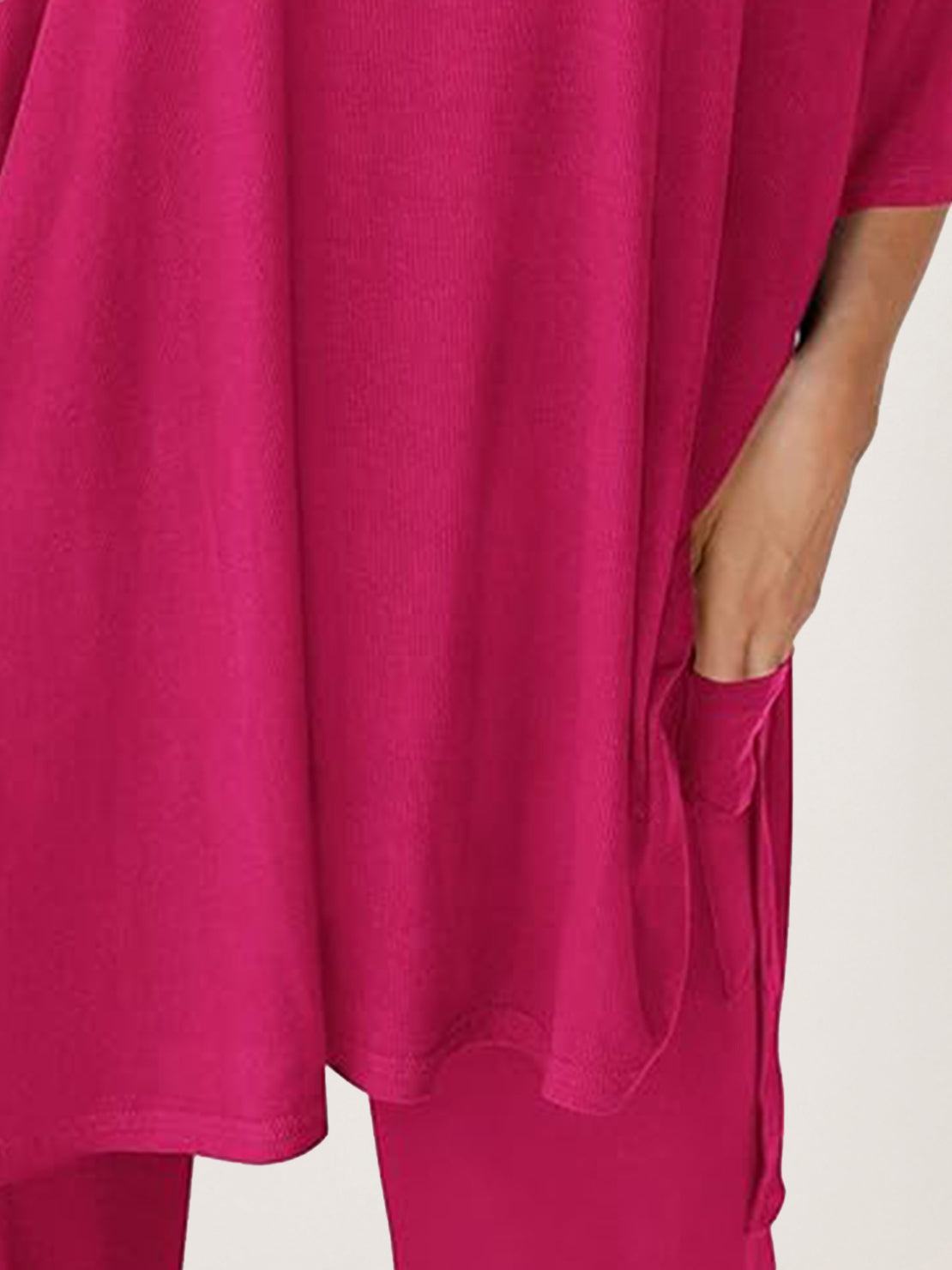 Woman wearing oversized long-line pullover and wide-leg pants loungewear set