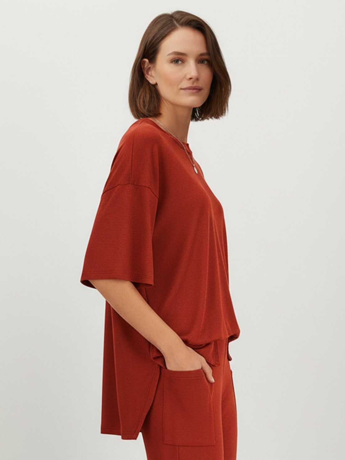 Oversized long-line pullover and wide-leg pants loungewear set in soft knit fabric with elastic waistband and side pockets