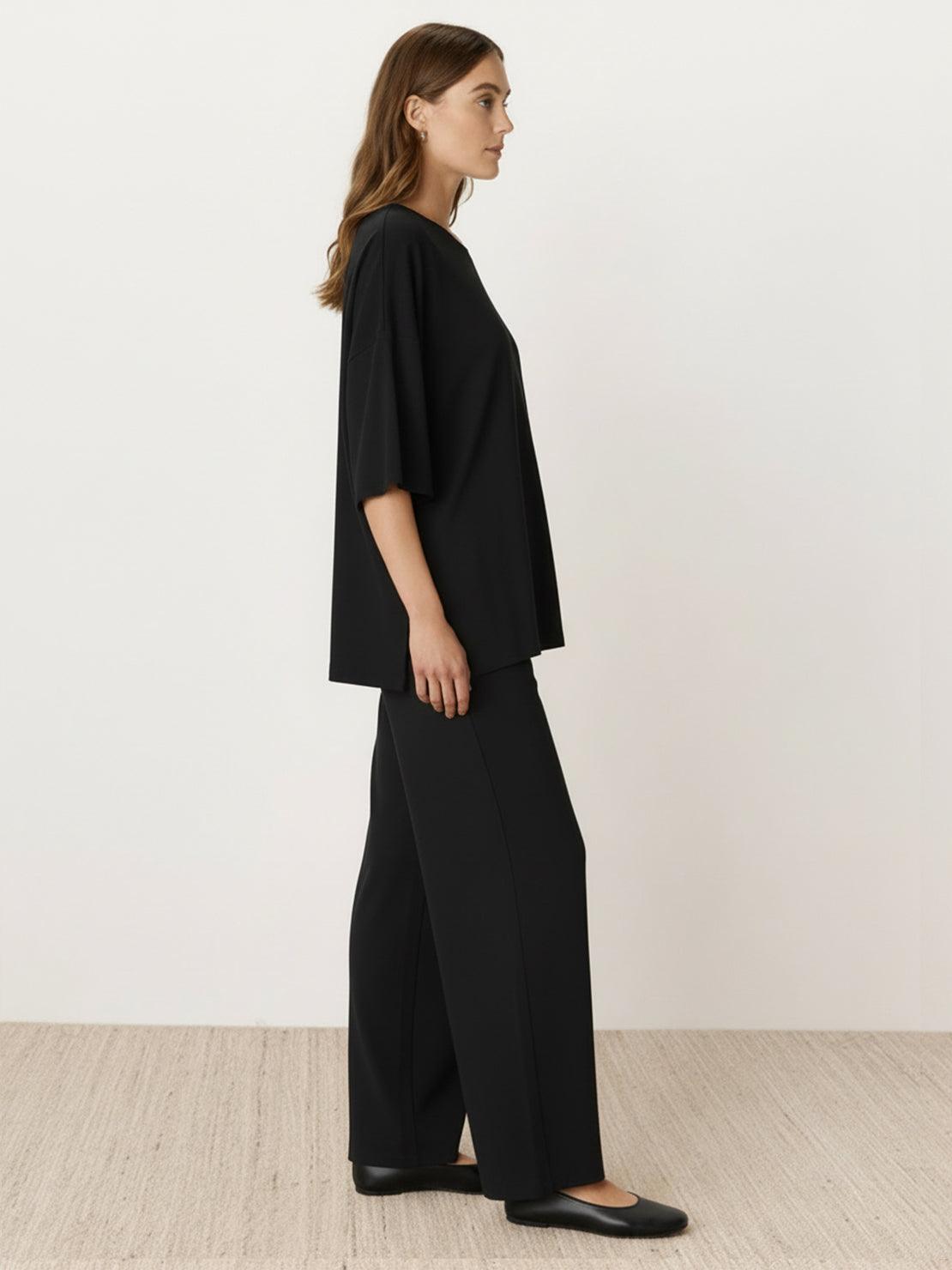 Oversized long-line loungewear set with pullover and wide-leg pants on model