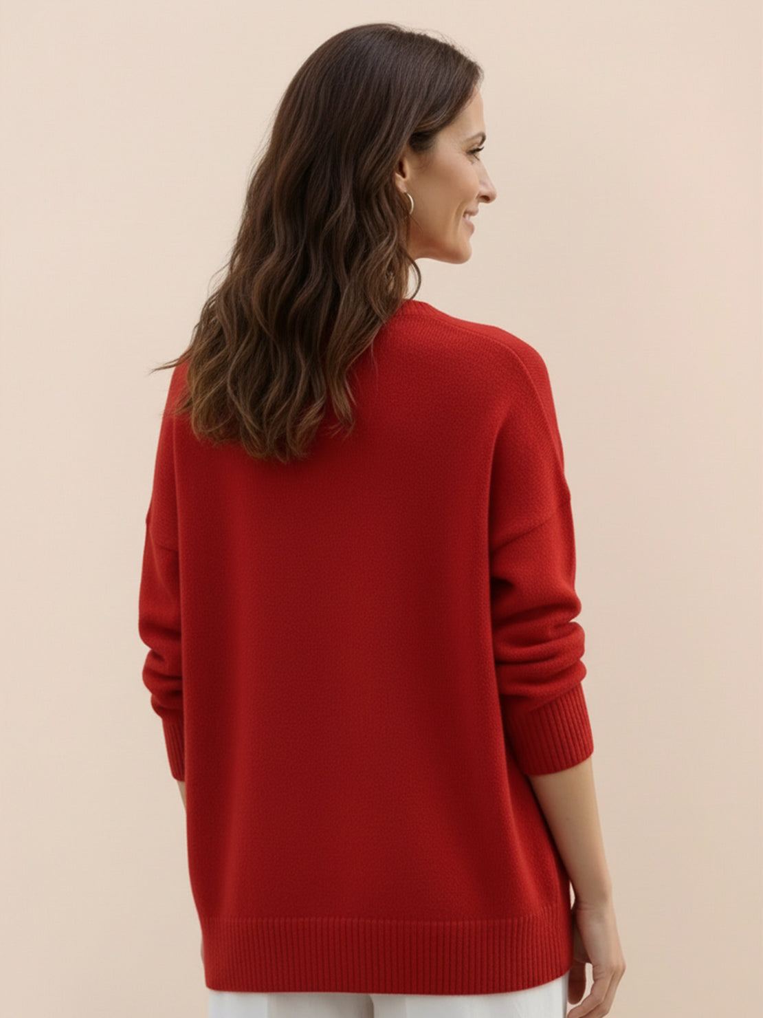 Oversized crew neck knit sweater with dropped shoulders and ribbed cuffs in neutral color