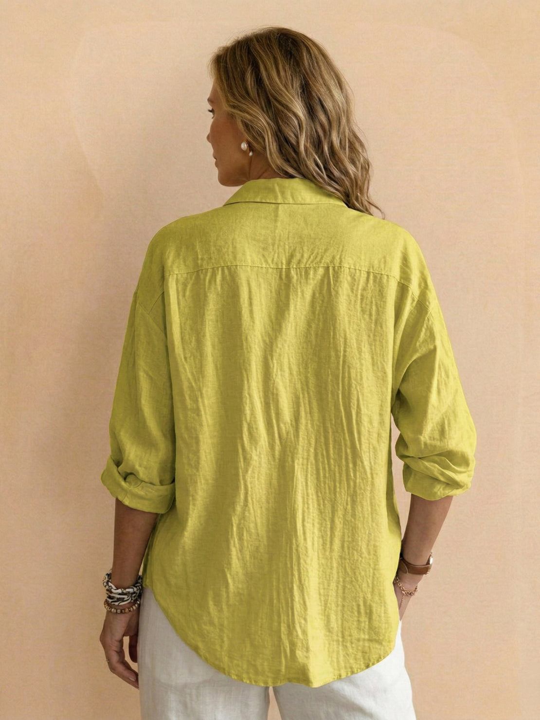 Lightweight cotton popover blouse with relaxed fit, classic collar, and curved hem