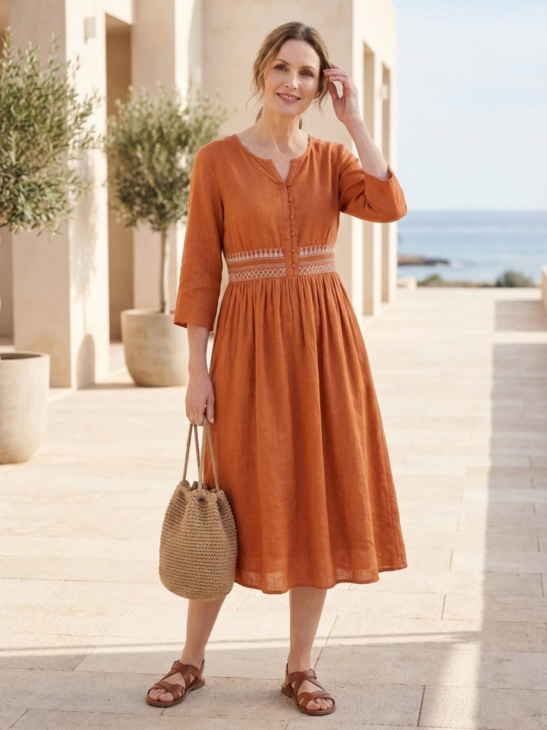 rusty orange cotton linen midi dress with embroidered smocked waist and V-notch neckline