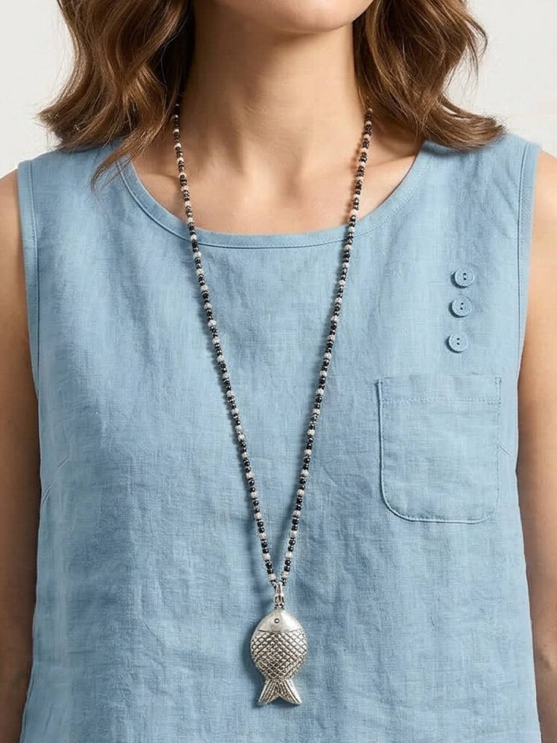 Lightweight 100% cotton linen sleeveless top with curved hem and chest pocket detail