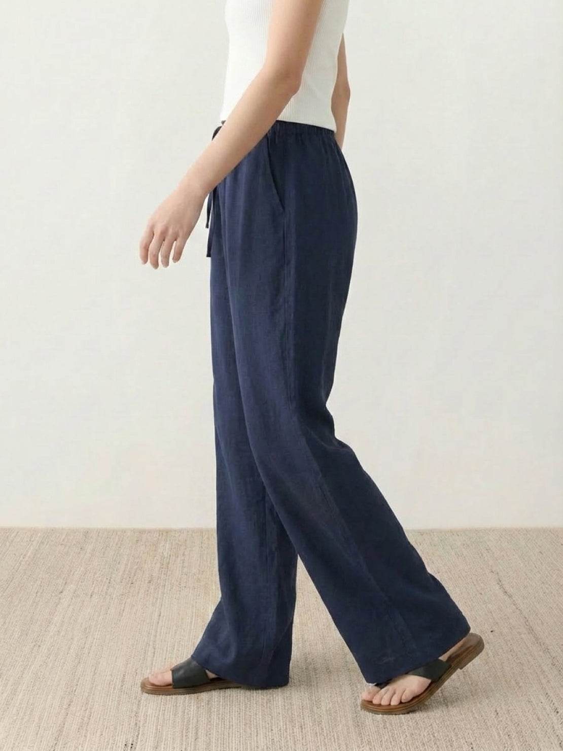 100% linen wide-leg pants with high-rise elastic waistband and side pockets
