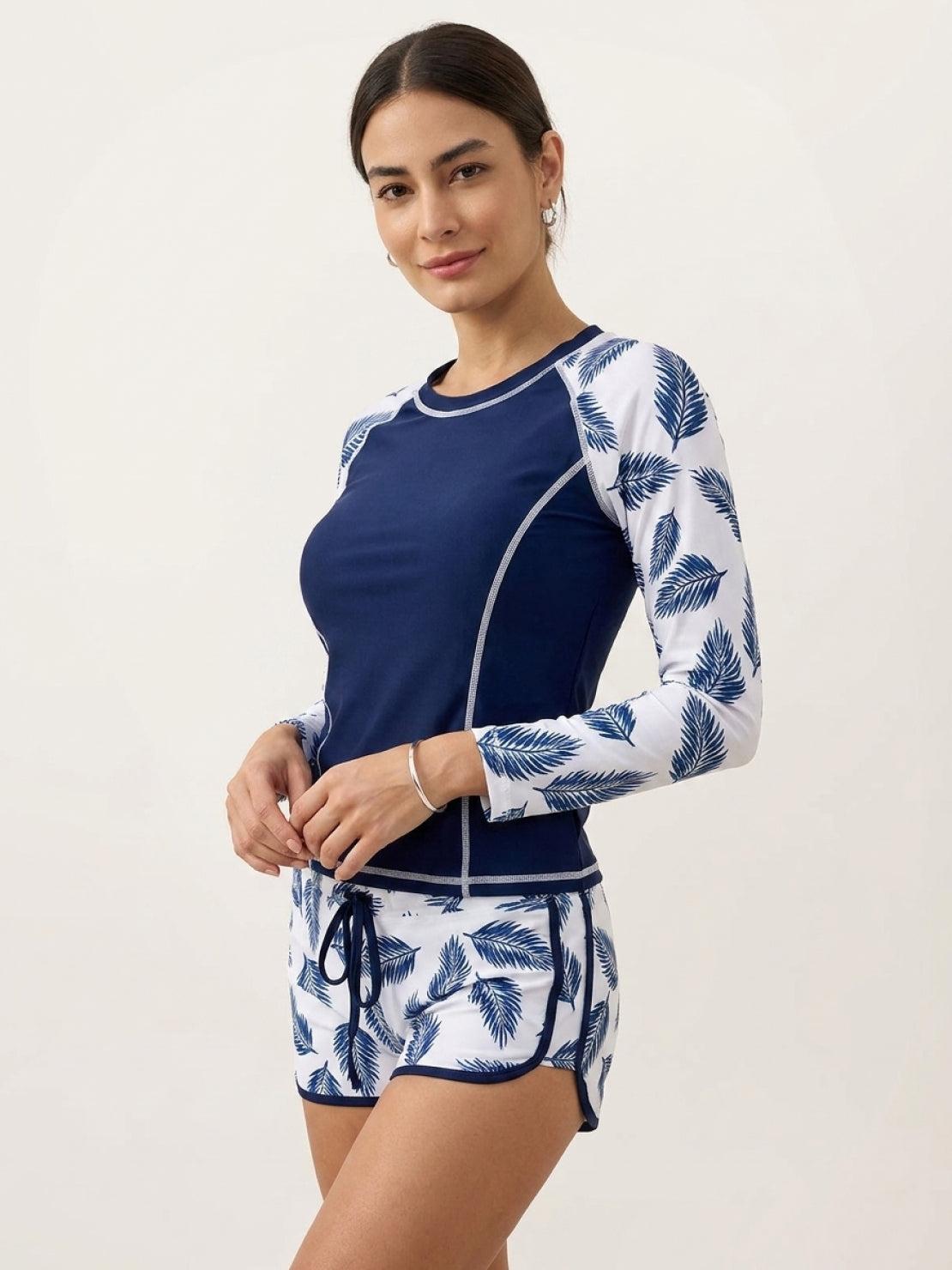 Long-sleeve UV rash guard set with tropical print shorts and sun protection fabric