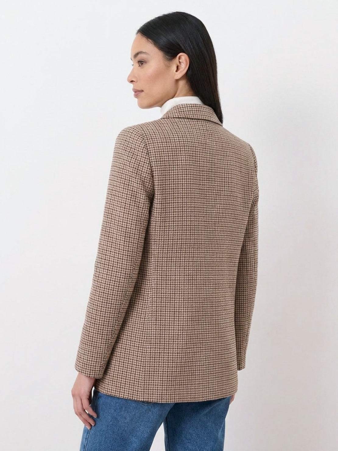 Black and white houndstooth commuter blazer with structured shoulders and relaxed fit