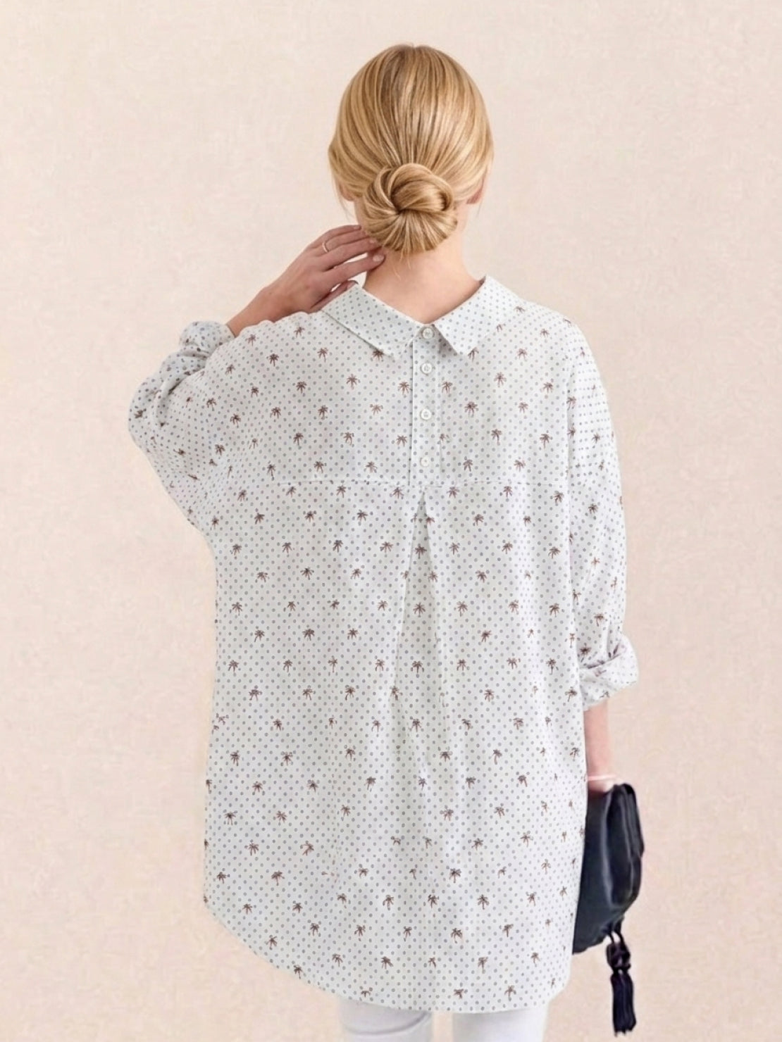 oversized linen shirt in relaxed fit with back-pleat detail and button-up front made from 100% cotton