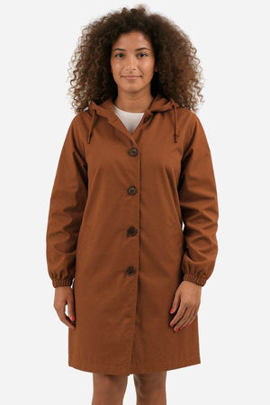 Water Resistant Oversized Windbreaker rain jacket in brown with hood and button closure worn by woman