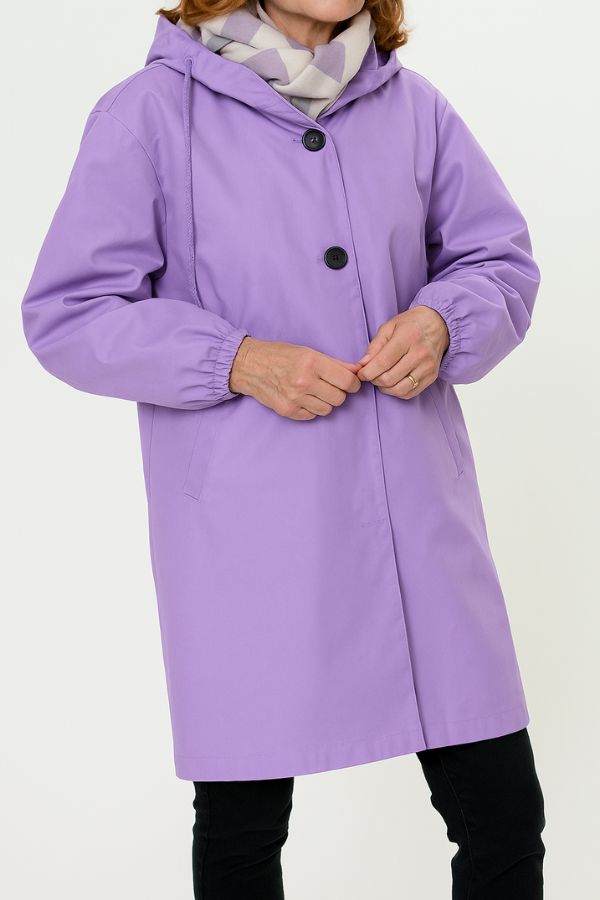 Purple water resistant oversized hooded windbreaker rain jacket on woman with scarf