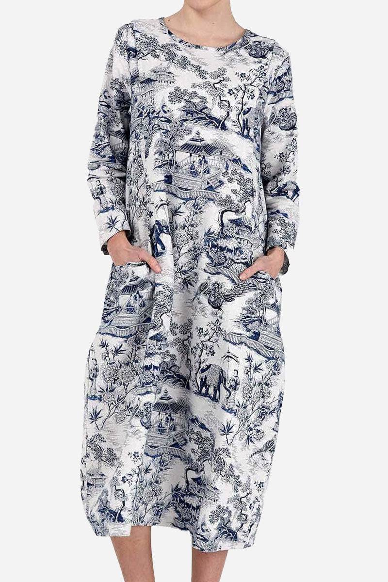 Japanese porcelain print midi dress with blue motif, rounded neckline, 3/4 sleeves, and two front pockets in loose fit design