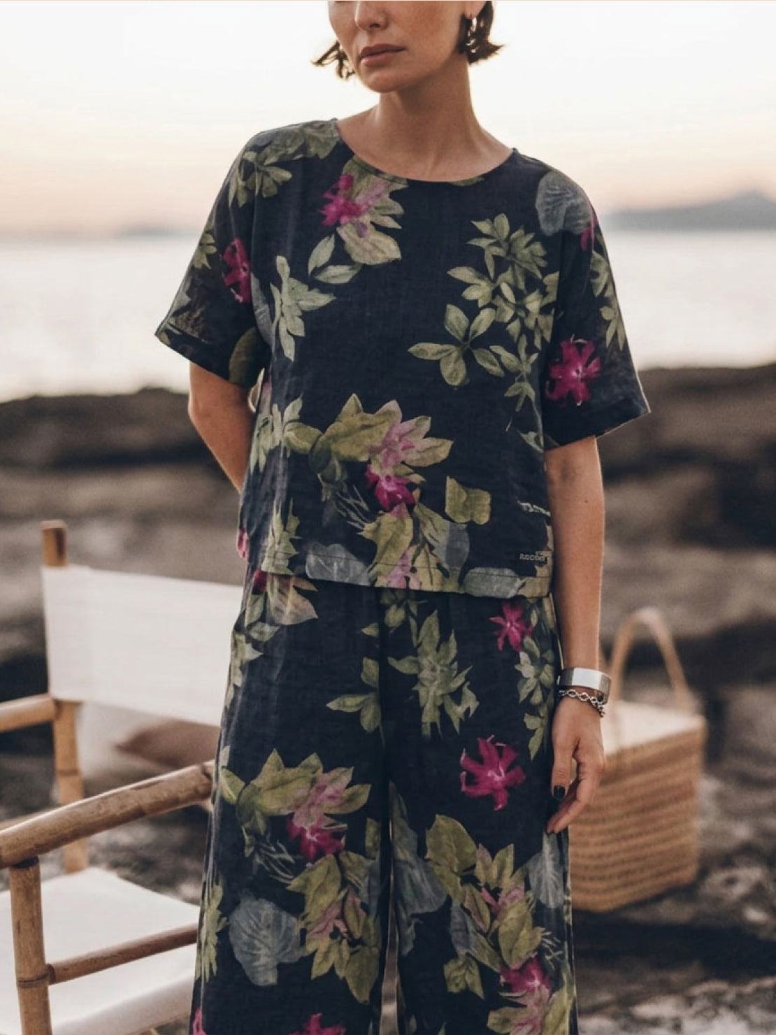 Woman wearing soft-tailored loose fit co-ord set with wide-leg cotton trousers and relaxed short-sleeve top