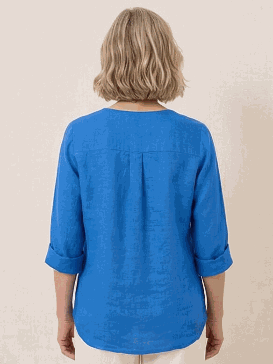 woman wearing pure linen age-defying shirt with button detail outdoors