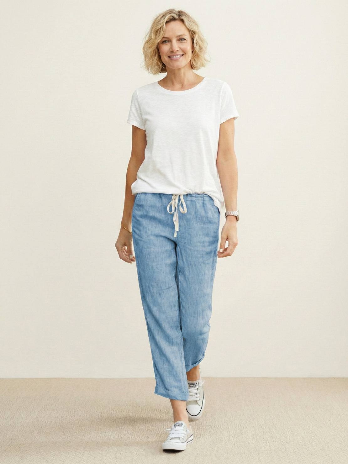 Woman wearing relaxed fit straight pants in stylish casual outfit