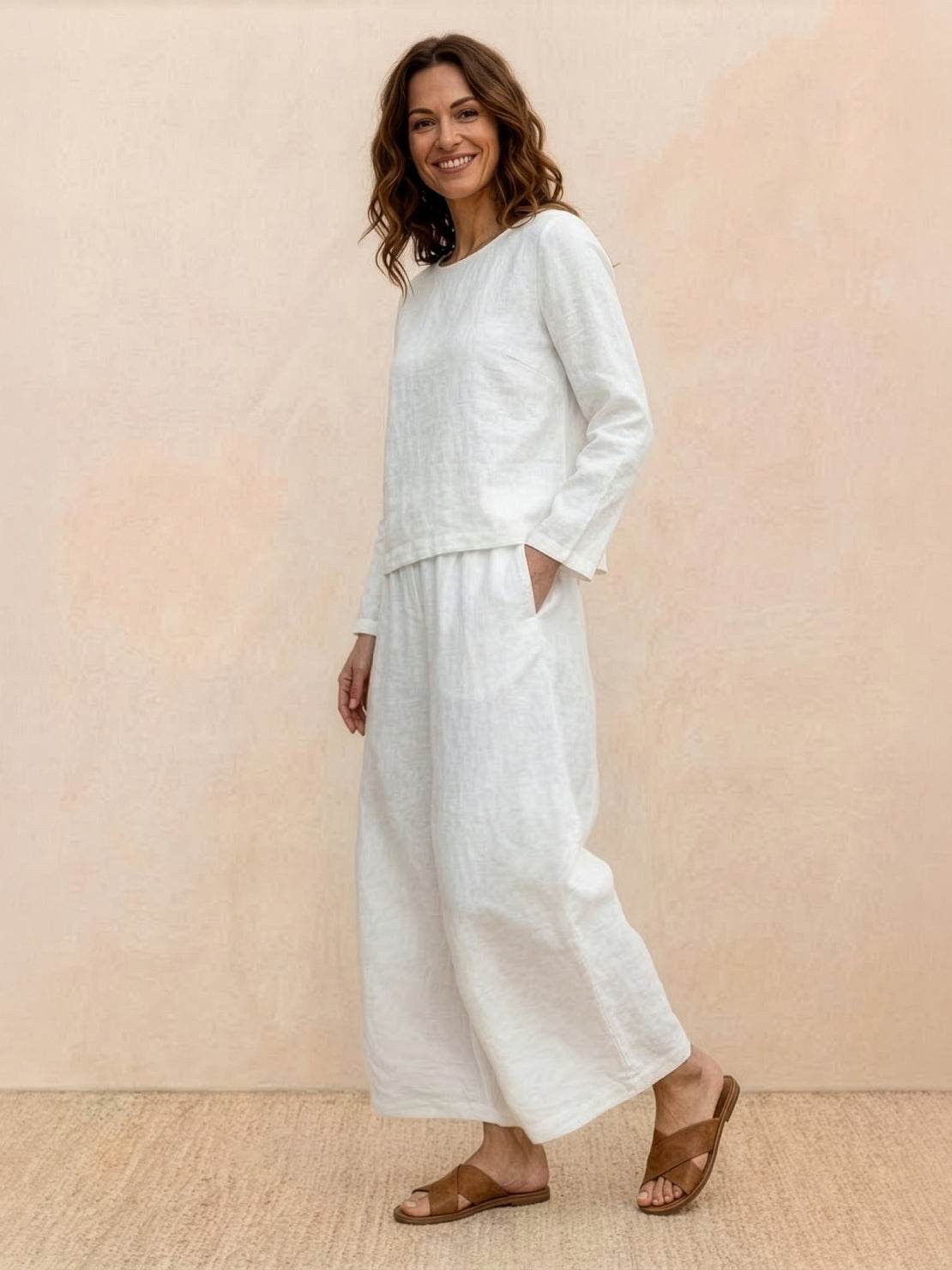 woman wearing loose solid color two-piece set with round-neck top and wide-leg pants outdoors