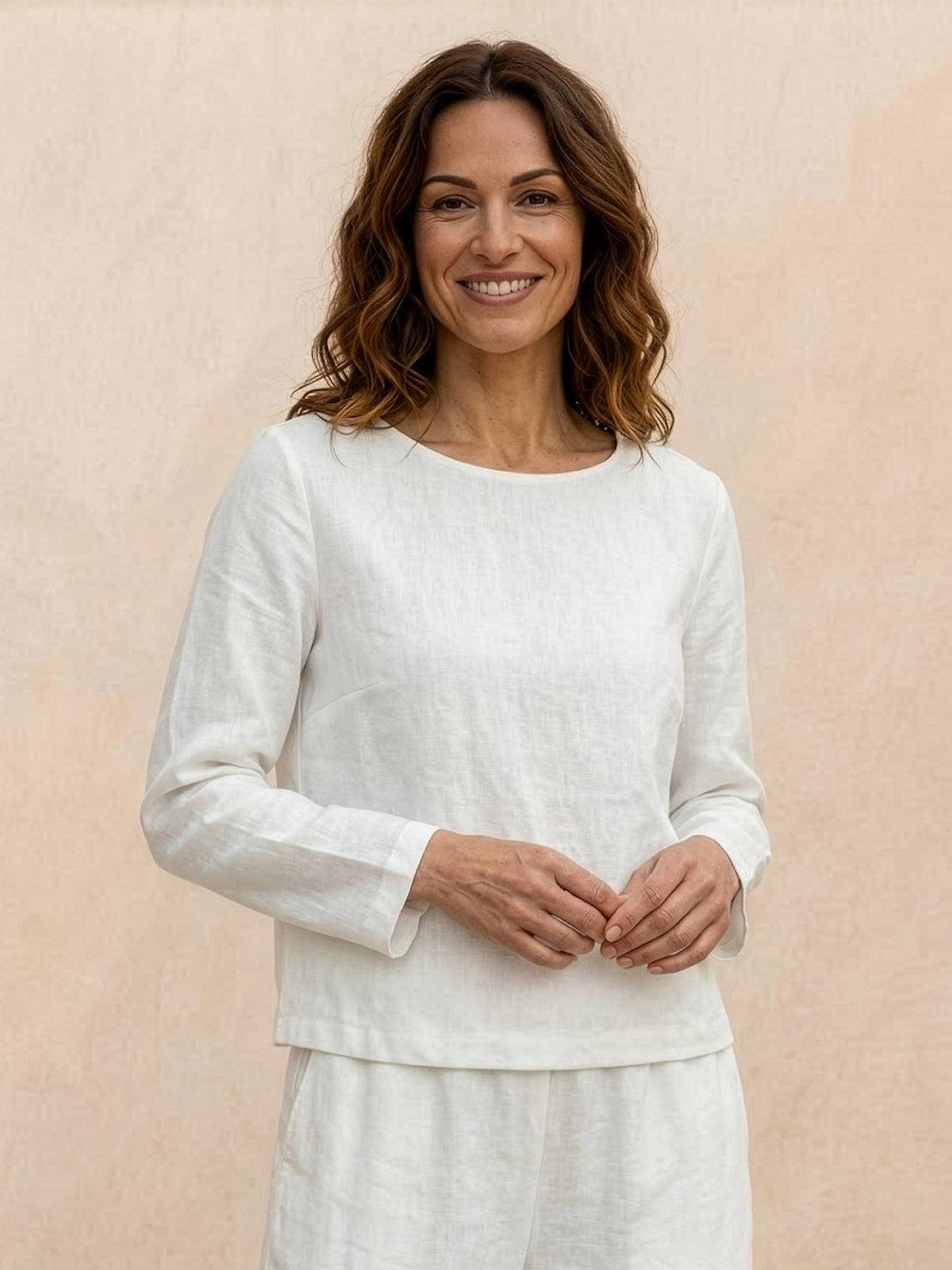 woman wearing loose solid color two-piece set with wide-leg pants and round-neck top