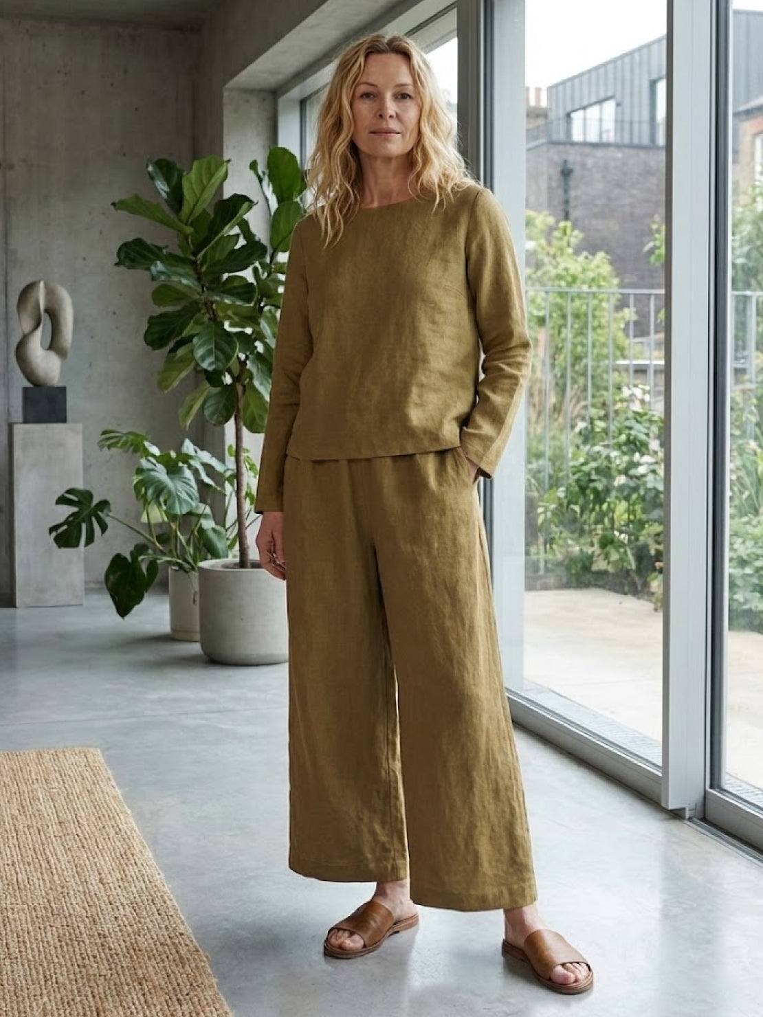 woman wearing loose solid color two-piece set with round-neck top and wide-leg pants in natural light