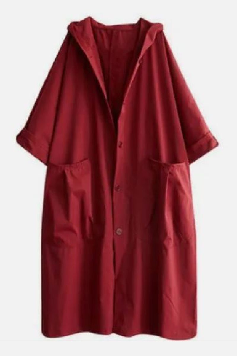 Oversized red water resistant windbreaker jacket with hood and front pockets